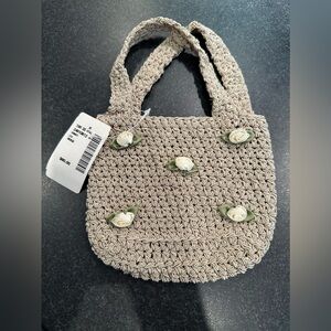 Elegant Crocheted Handbag with Satin Rosettes